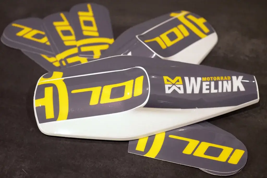 Grey and yellow handguard graphics for Husqvarna 701