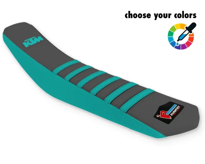 Grauer KTM Sitzbankbezug für Motocross, Enduro & Supermoto mit türkisfarbenen Rippen, türkisfarbenen Seiten und KTM-Logo.