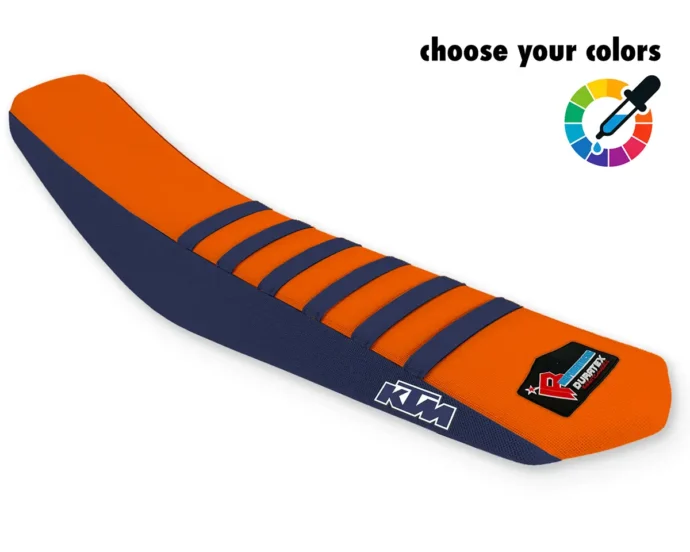 Oranger KTM Sitzbankbezug für Motocross, Enduro & Supermoto mit dunkelblauen Rippen, dunkelblauen Seiten und KTM-Logo.